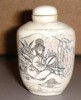 Bone carving: Picture of women holding a fan