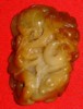 Orange-red coloured jade piece
